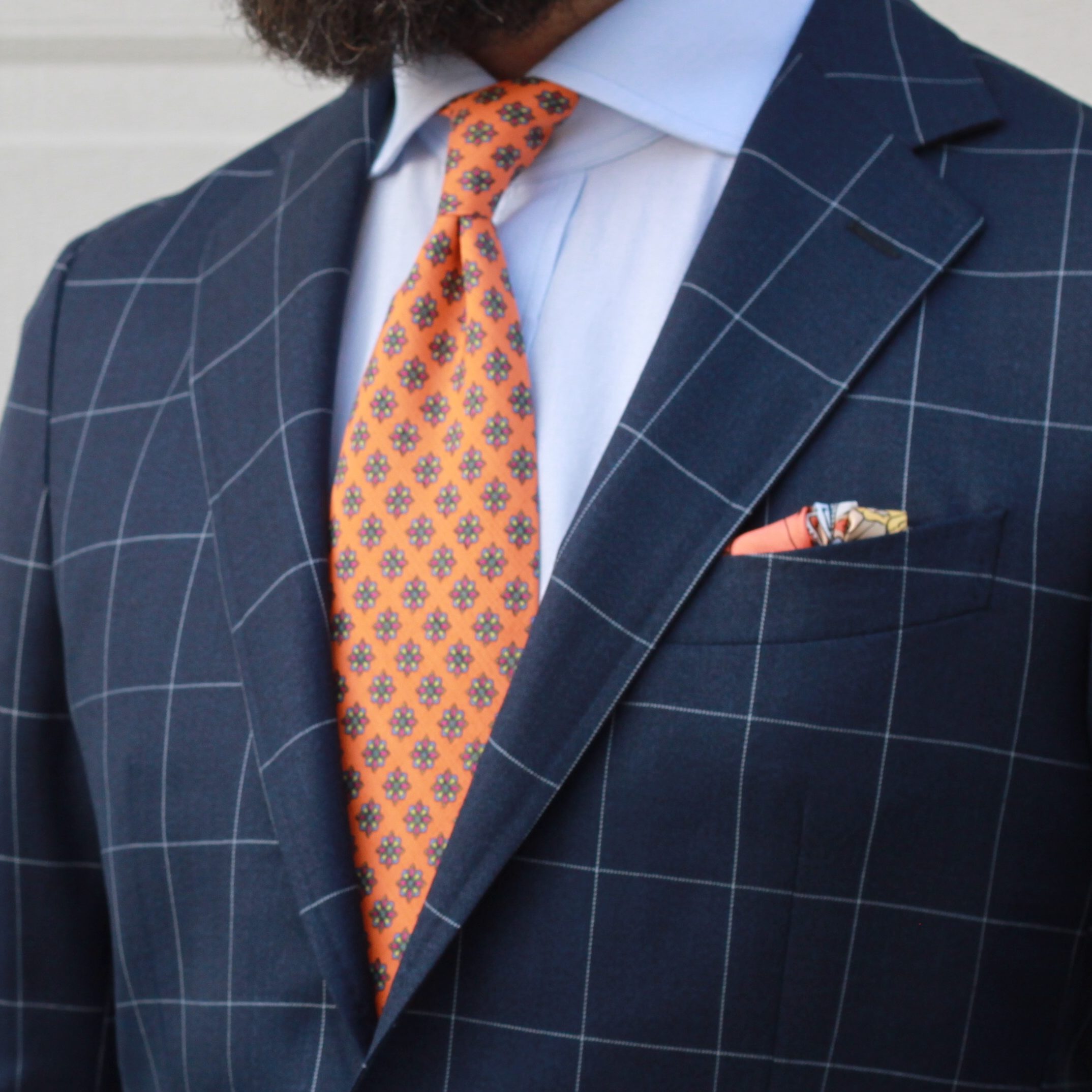 blue suit orange tie