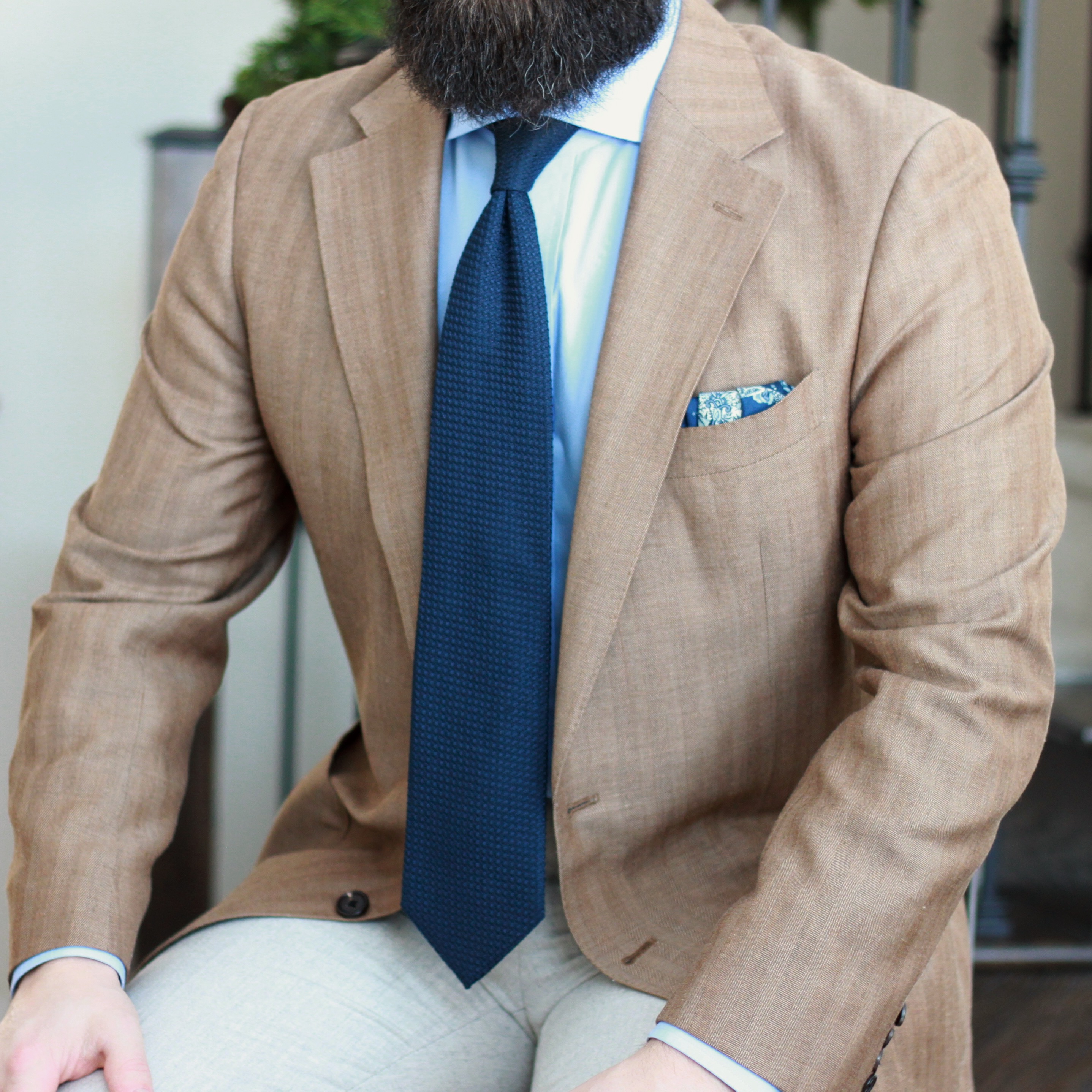 sport coat, grenadine tie, photography, seated, herringbone, 