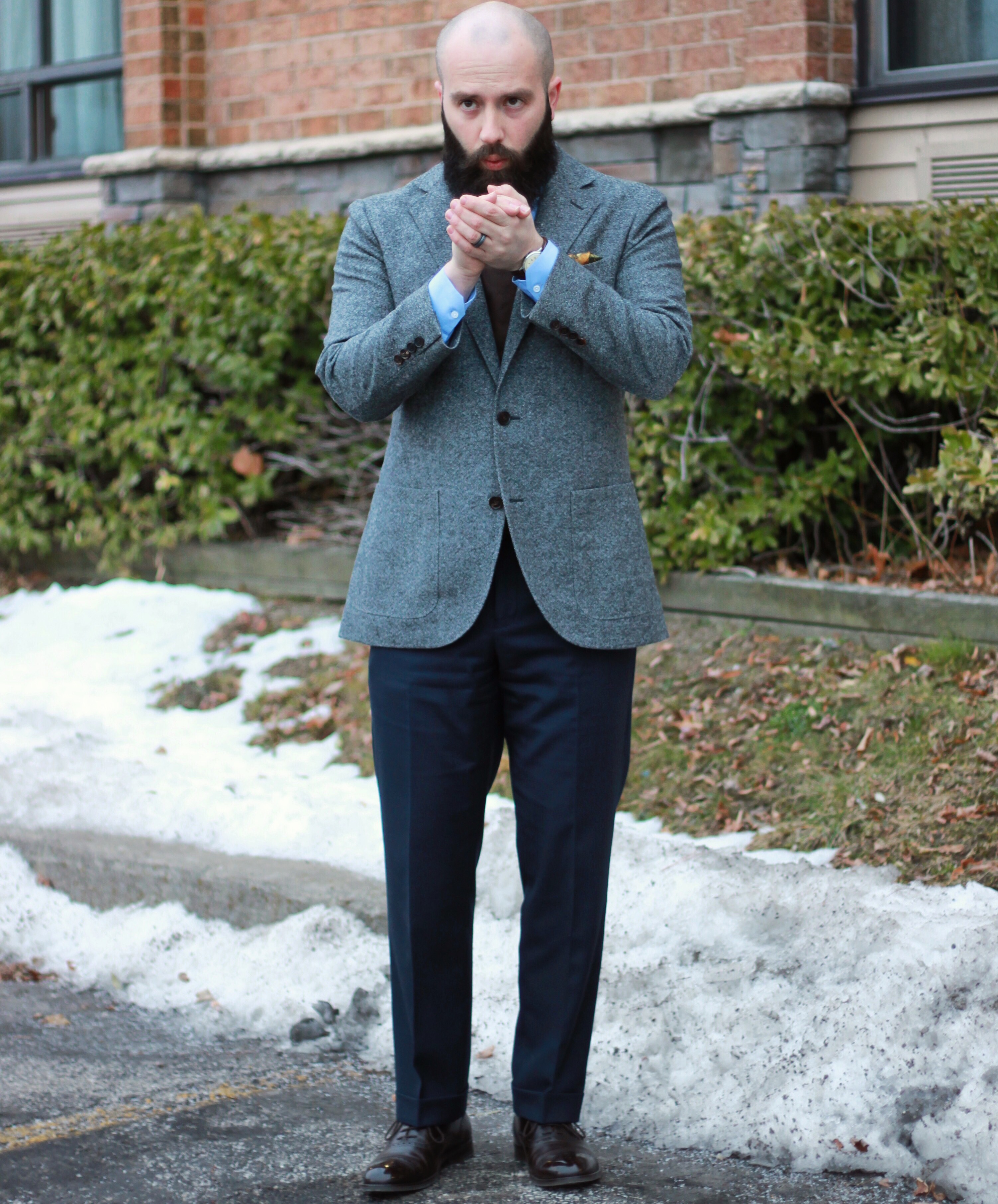 navy shirt and grey pants